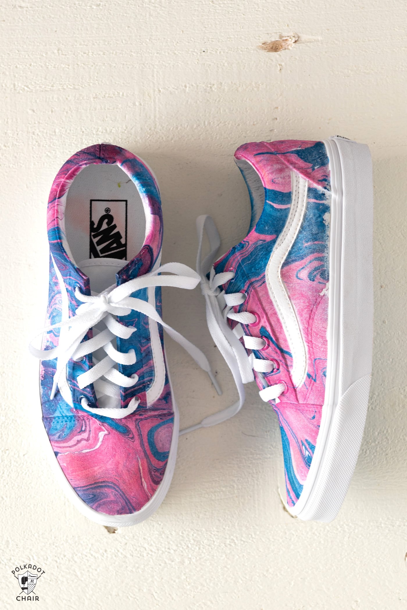 navy and pink hydro dipped vans on white table